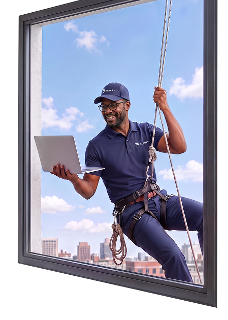 A Starry tech hanging out a window with a laptop
